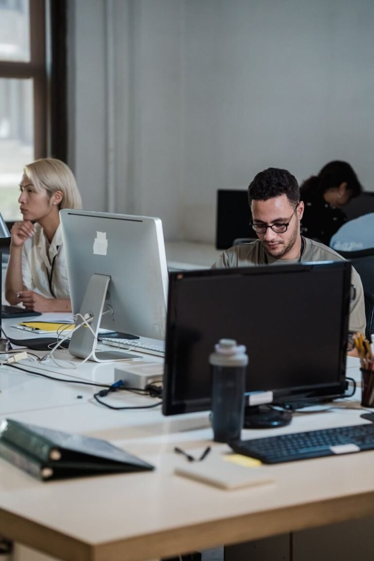 Office team working at their desks on computers