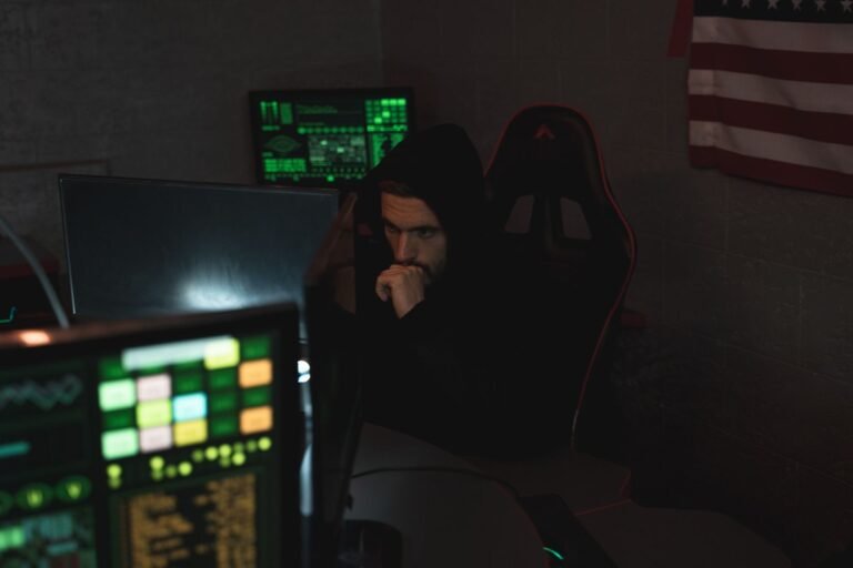 Cybersecurity specialist monitoring several screens for threats