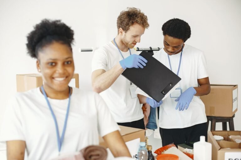 Volunteers organizing donations together indoors