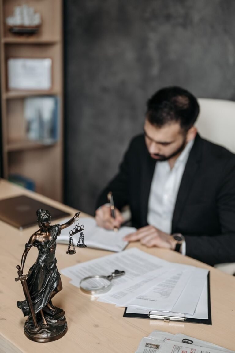 Lawyer reviewing paperwork at an office desk